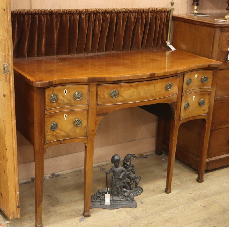 A George III style mahogany serpentine sideboard, W.136cm, D.62cm, H.93cm